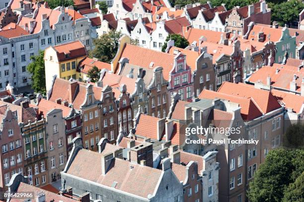 roofs of the old hanseatic tenement houses in gdansk's old town, poland - gdansk stock pictures, royalty-free photos & images