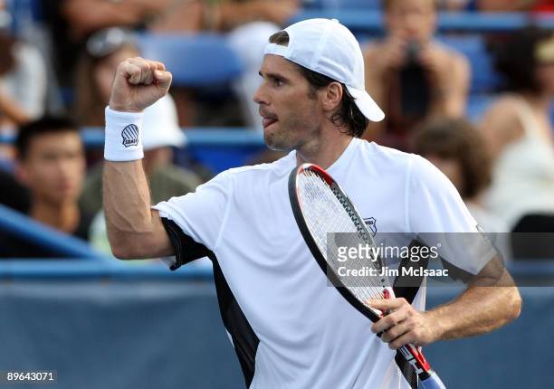 Tommy Haas of Germany celebrates after defeating Juan Carlos Ferrero of Spain during Day 4 of the Legg Mason Tennis Classic at the William H.G....