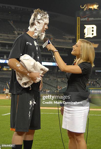 Brian Matusz of the Baltimore Orioles gives an interview after getting a shaving cream pie on his face after the victory against the Detroit Tigers...