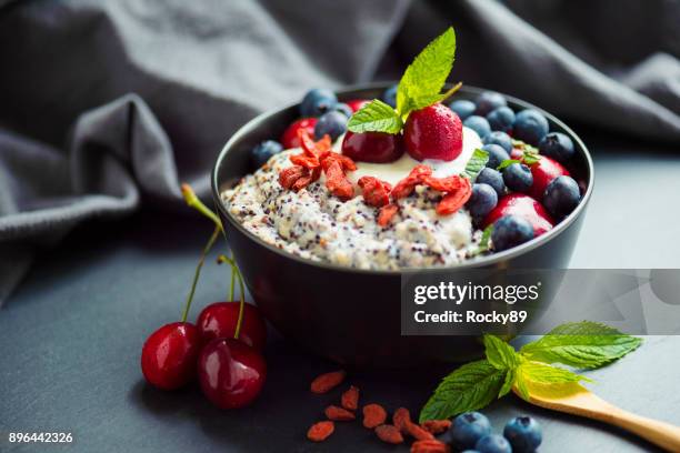organic chia and quinoa porridge - goji berry stock pictures, royalty-free photos & images