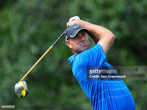 Stewart Cink plays a shot on the 14th hole during the first round of the WGC-Bridgestone Invitational on the South Course at Firestone Country Club...