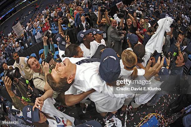 Final Four: UConn coach Geno Auriemma victorious carried by team after winning game vs Louisville. St. Louis, MO 4/7/2009 CREDIT: David E. Klutho