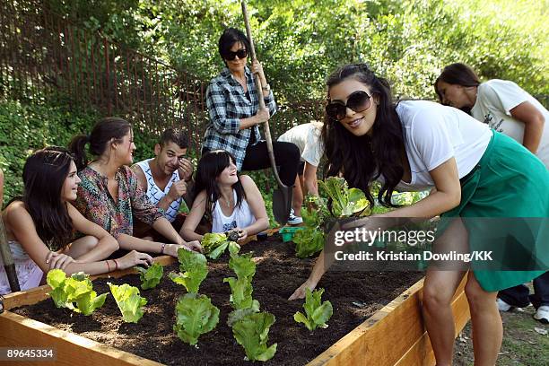 Kendall Jenner, Khloe Kardashian, Rob Kardashian, Kylie Jenner, Kris Jenner and Kim Kardashian plant a vegetable garden at their family home on...