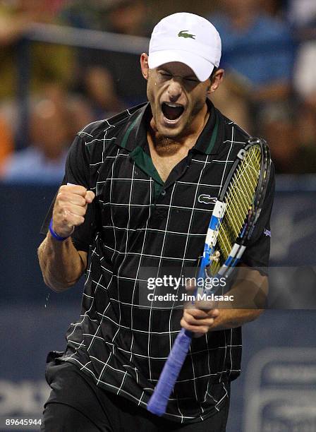 Andy Roddick celebrates a point in the final game against Sam Querrey during Day 4 of the Legg Mason Tennis Classic at the William H.G. FitzGerald...