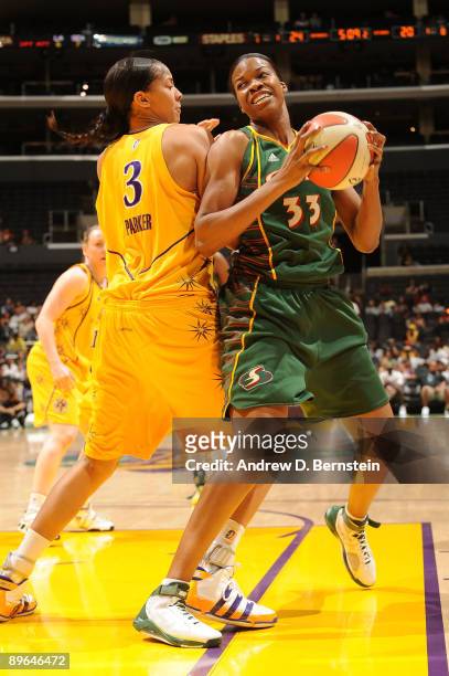 Candace Parker of the Los Angeles Sparks blocks against Janell Burse of the Seattle Storm at Staples Center August 6, 2009 in Los Angeles,...