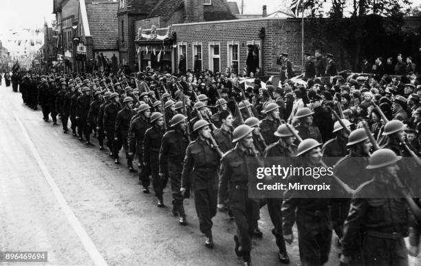 Members of the Home Guard taking part in the procession that ends Bracknell's War Weapons Week, 25th May 1941.