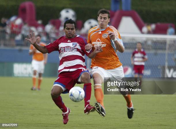 David Ferreira of the FC Dallas kicks the ball away from Geoff Cameron of the Houston Dynamo at Pizza Hut Park August 6, 2009 in Frisco, Texas.