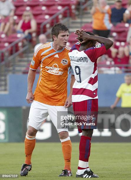Bobby Boswell of the Houston Dynamo reacts to a missed penalty kick by Jeff Cunningham of the FC Dallas at Pizza Hut Park August 6, 2009 in Frisco,...