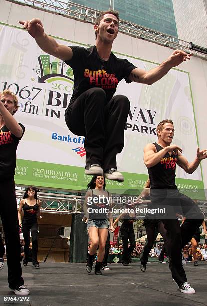 The cast of Burn the Floor performs during the 2009 Broadway in Bryant Park concert series presented by 106.7 Lite fm on August 6, 2009 in New York...
