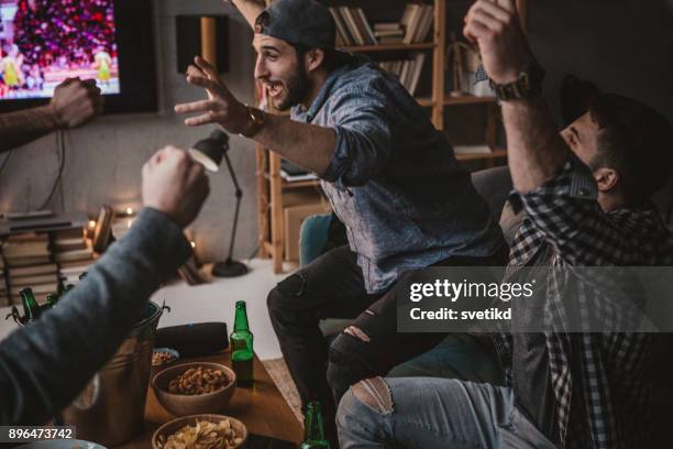 i love this game - watching sport television stock pictures, royalty-free photos & images