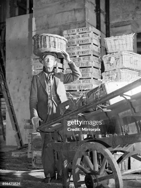 Filming of Pygmalion, directed by Anthony Asquith and Leslie Howard, at at Pinewood Studios, London, England, 20th March 1938. Jack May who plays...