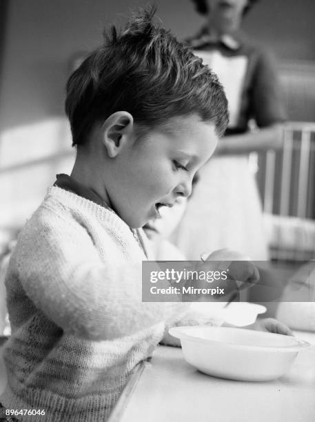 Little Philip Kerley aged two and a half of Bournemouth, seen here recovering in hospital after eating a special cement glue used for sticking down...