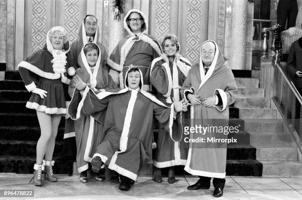 The cast of 'Are You Being Served?' pictured during the shooting of their Christmas show. Pictured left to right, John Inman , Frank Thornton ,...