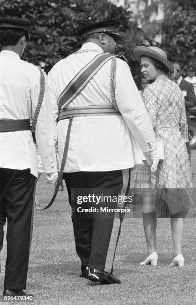 Queen Elizabeth II seen here in Tonga with the King Taufa'ahau Tupou IV of Tonga during her on her Silver Jubilee tour of Australia and the Far East,...