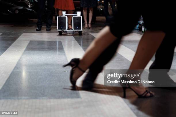 People dance Tango in Piazza Affari, head office of the Italian Stock Exchange, on July 29 2009 in Milan, Italy. The tango lovers are members of the...