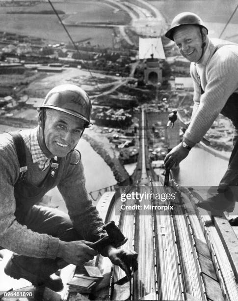 The Forth Road bridge from South Queensferry to North Queensferry, during construction. Workmen Robert Orr and David Gillies on the bridge, 512 feet...