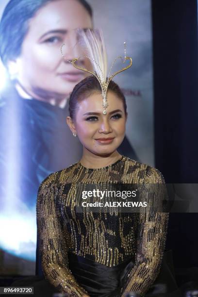 This photo taken on December 20, 2017 shows Indonesian singer Rossa during an event in Jakarta. / AFP PHOTO / ALEX KEWAS