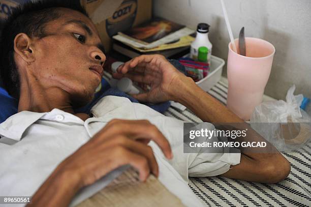 Asia-health-AIDS-Indonesia BY ARLINA ARSHAD In a picture taken on July 16 a prisoner and former intravenous drug user afflicted with HIV lies on a...