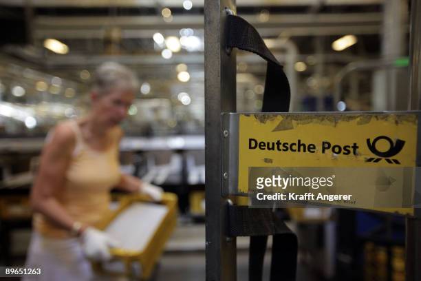 Employee sorts voting cards at the delivery post office on August 7, 2009 in Hamburg, Germany. Today starts the dispath by post of 1.26 million...