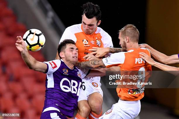 Nicholas D'Agostino of the Roar and Brandon Wilson of the Glory compete for the ball during the round 11 A-League match between the Brisbane Roar and...