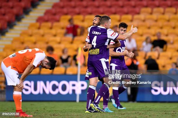 Shane Lowry and Xavier Torres of the Glory celebrate victory after the round 11 A-League match between the Brisbane Roar and the Perth Glory at...