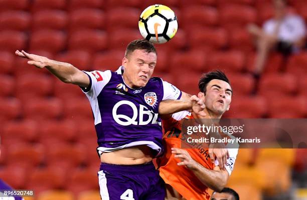 Nicholas D'Agostino of the Roar and Shane Lowry of the Glory challenge for the ball during the round 11 A-League match between the Brisbane Roar and...