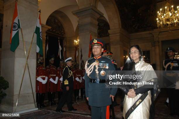 President Pratibha Patil confer the honorary rank of General of the Indian Army on Nepalese Army chief General Rookmangud Katawal at Special Defence...