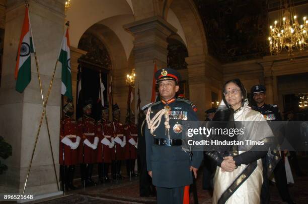 President Pratibha Patil confer the honorary rank of General of the Indian Army on Nepalese Army chief General Rookmangud Katawal at Special Defence...