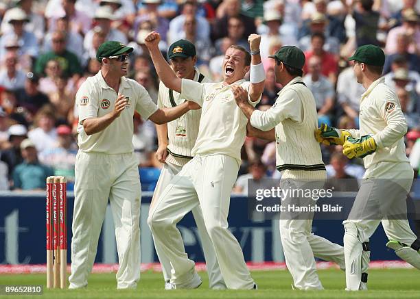 Peter Siddle of Australia celebrates the wicket of Graham Onions of England with team mates during day one of the npower 4th Ashes Test Match between...