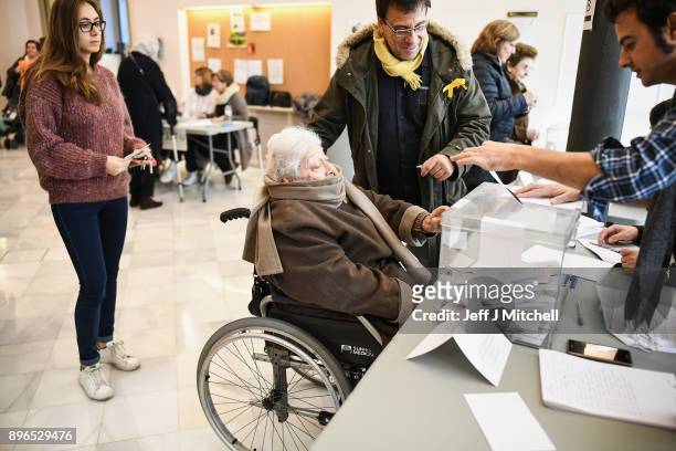 People cast their vote inside a polling station at the University School of Industrial Technical Engineering of Barcelona on December 21, 2017 in...