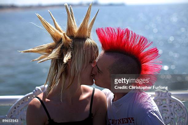 Punk lovers kiss on the Central Pier as rebels from across the world arrive for the Rebellion Festival on August 7, 2009 in Blackpool, England....
