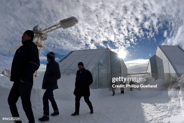 Visitors inspect the aerial tramway summit station of the new "Eibsee Seilbahn" cable car connection departs for the Zugspitze peak on the system's...