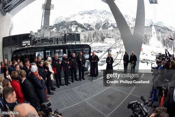 An aerial tramway of the new "Eibsee Seilbahn" cable car connection is blessed before its departure for the Zugspitze peak on the system's...