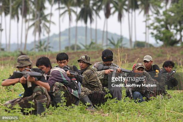 Muslim rebels belonging to the Moro Islamic Liberation Front , the country's largest rebel group take part in a combat drill on July 30, 2009 in the...