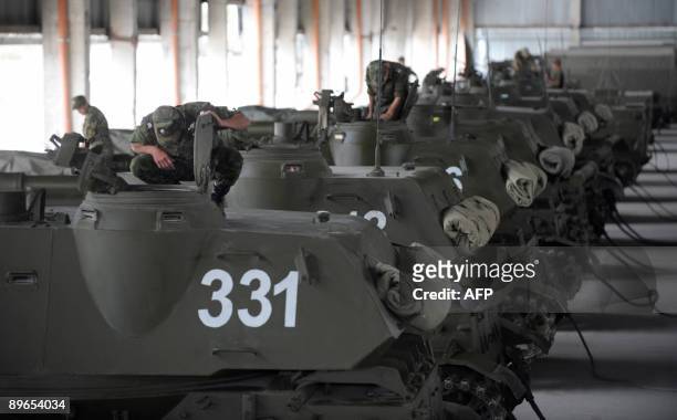 Russian soldiers prepare tanks at the Tskhinvali military base on August 7, 2009. Russia faces a "complete diplomatic defeat" due to the refusal of...