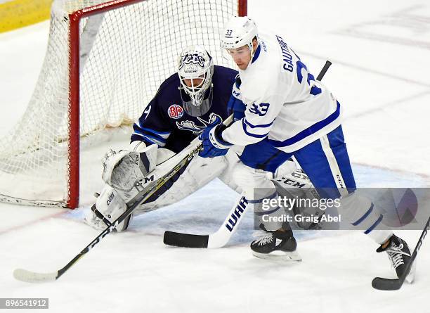 Frederik Gauthier of the Toronto Marlies gets in front of goalie Michael Hutchinson of the Toronto Marlies during AHL game action on December 17,...