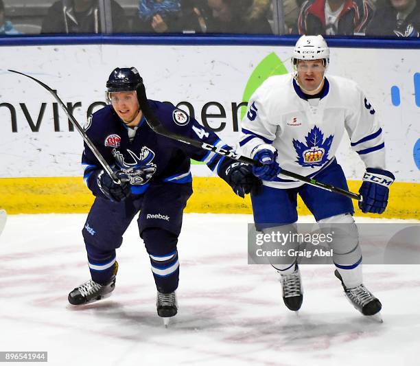 Vincent LoVerde of the Toronto Marlies turns up ice against Michael Sgarbossa of the Manitoba Moose during AHL game action on December 17, 2017 at...