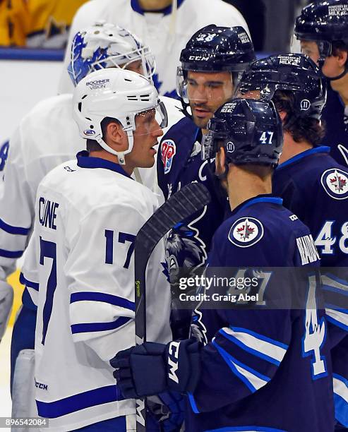 Charles-David Beaudoin, Brendan Lemieux and Patrice Cormier and Richard Clune have a chat in warmup prior to a game against on December 17, 2017 at...