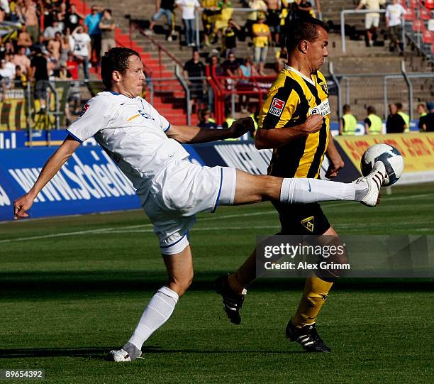 Michael Mutzel of Karlsruhe clears the ball ahead of Szilard Nemeth of Aachen during the Second Bundesliga match between Karlsruher SC and Alemannia...