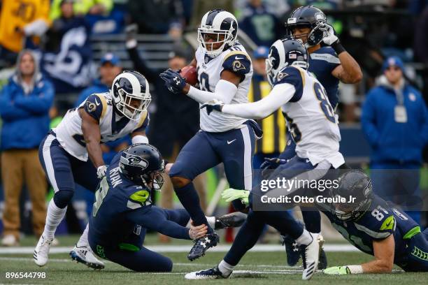 Punt returner Pharoh Cooper of the Los Angeles Rams rushes against the Seattle Seahawks during the first quarter at CenturyLink Field on December 17,...