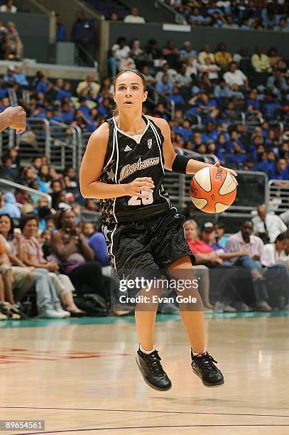 Becky Hammon of the San Antonio Silver Stars drives the ball to the basket during the WNBA game against the Los Angeles Sparks on August 4, 2009 at...