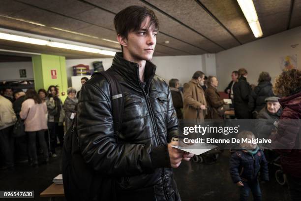 Voter waits to cast his ballot for the Catalan regional election at Fort Pienc school polling station on December 21, 2017 in Barcelona, Spain....