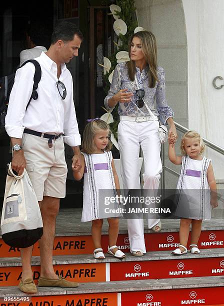 Princess Letizia of Spain walks with her husband Felipe and their daughters Leonor and Sofia as they leave the Club Nautico de Palma, on August 7,...