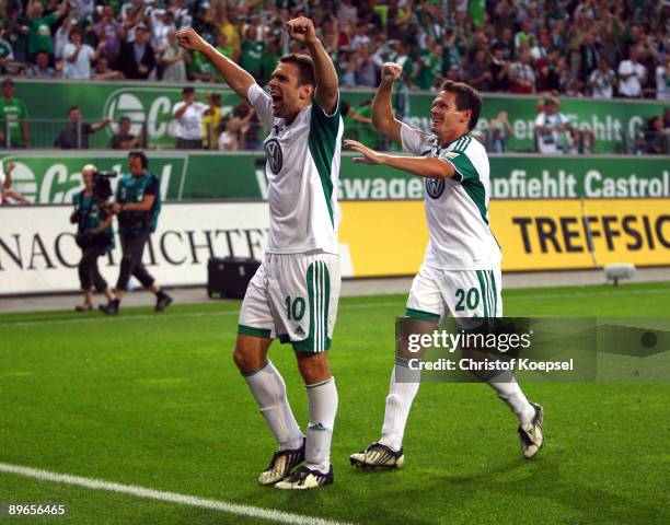 Zvjezdan Misimovic of Wolfsburg celebrates the first goal with Sascha Riether during the Bundesliga match between VfL Wolfsburg and VfB Stuttgart at...