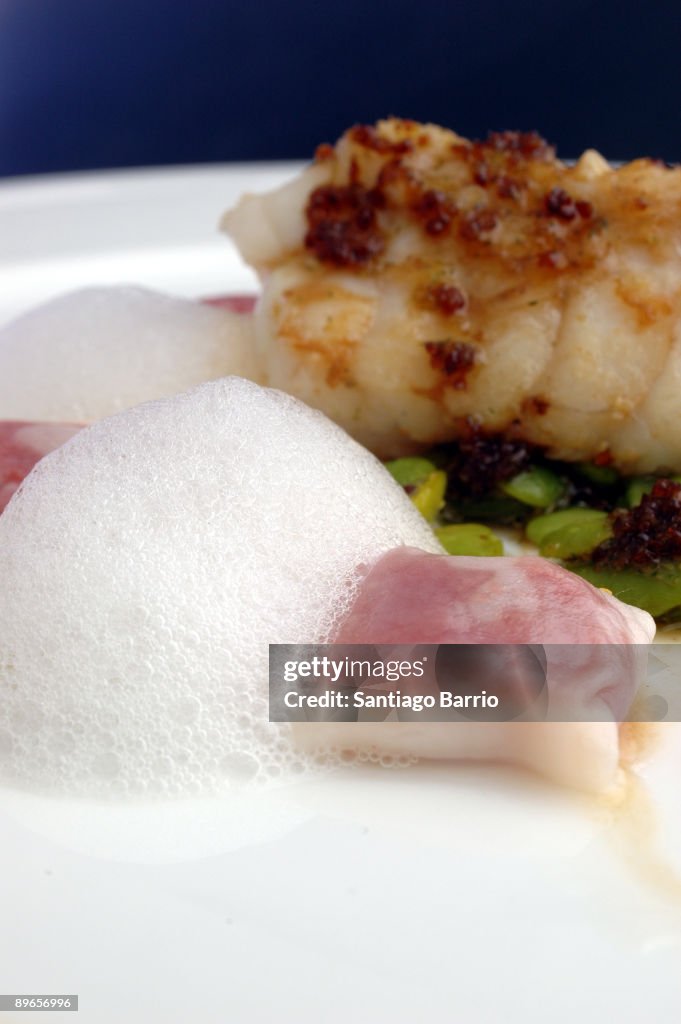 Menu cooked by Ferran Adria, Juan Maria Arzak y Paco Roncero that will be served on the Gala dinner in El Pardo Palace In this picture: Monkfish with mint beans with iberian tomato ravioli and jerez vinager