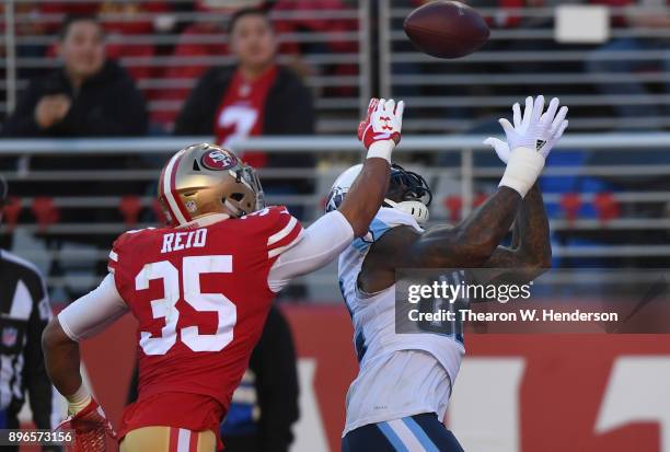 Eric Reid of the San Francisco 49ers breaks up this pass to Delanie Walker of the Tennessee Titans during their NFL football game at Levi's Stadium...