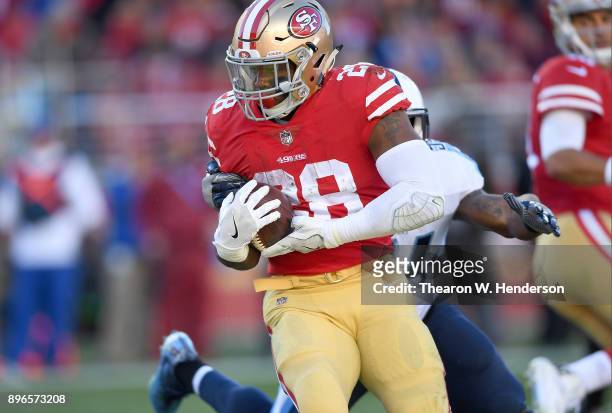 Carlos Hyde of the San Francisco 49ers carries the ball against the Tennessee Titans during their NFL football game at Levi's Stadium on December 17,...