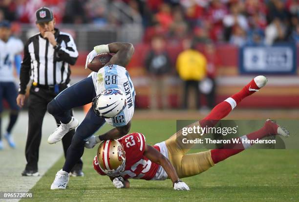 Delanie Walker of the Tennessee Titans gets tackled by Ahkello Witherspoon of the San Francisco 49ers during their NFL football game at Levi's...