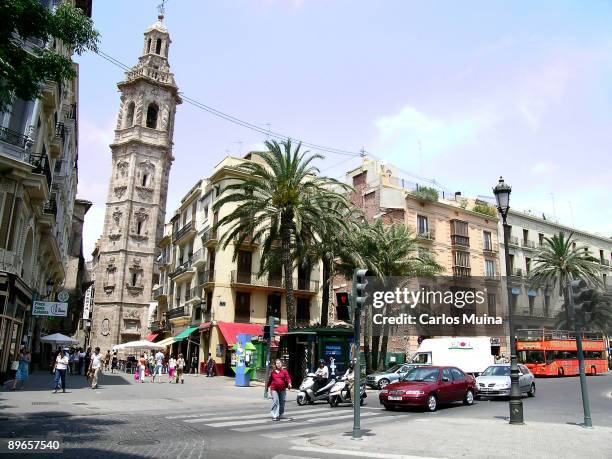 Valencia. Valencian Comunity, Spain. Reina Square, church and Santa Catalina Tower.