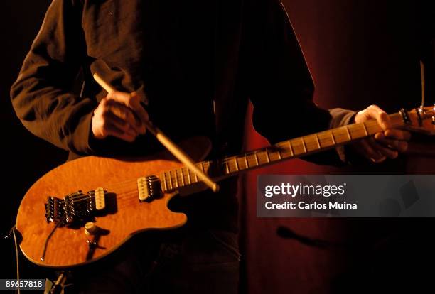 The Riviera auditorium. Madrid Concert of Yann Tiersen presenting its last record work 'Les Retrouvailles'. Guitarist playing its instruments with a...